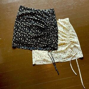 Two L.A.Hearts ruched floral mini skirts